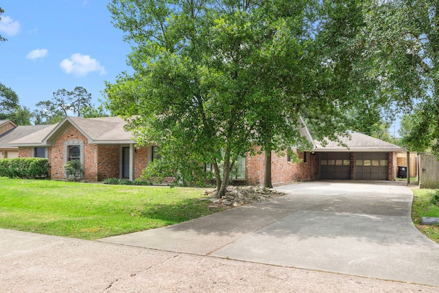 10139 Knoboak Dr, Houston, TX 77080 - view of front of house featuring brick siding, a front yard, concrete driveway, and an attached garage