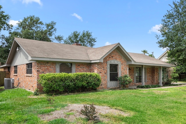 10139 Knoboak Dr, Houston, TX 77080 - ranch-style home featuring brick siding, a front yard, central air condition unit, a chimney, and a shingled roof