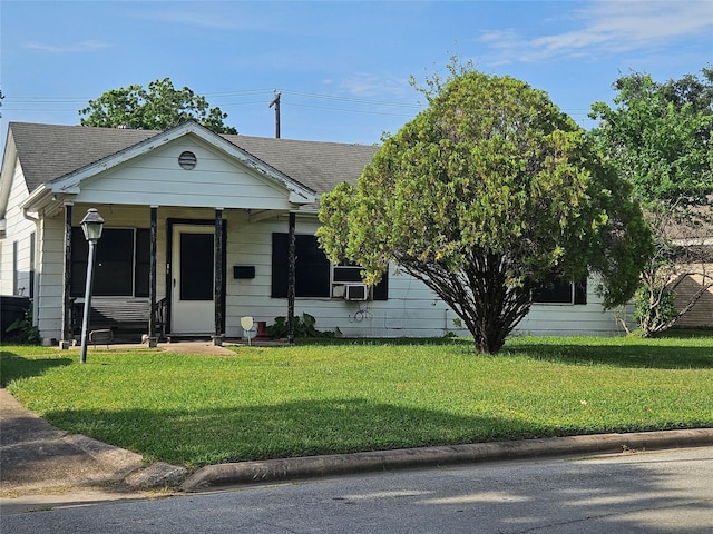 2219 8th St, Galena Park, TX 77547 - view of front of home featuring a front yard and roof with shingles