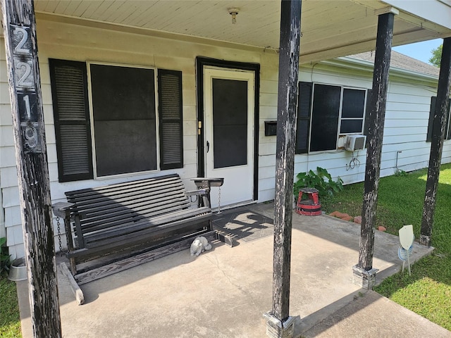 2219 8th St, Galena Park, TX 77547 - entrance to property featuring a porch and cooling unit