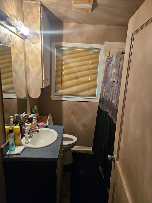 2219 8th St, Galena Park, TX 77547 - bathroom featuring vanity, toilet, and a shower with shower curtain