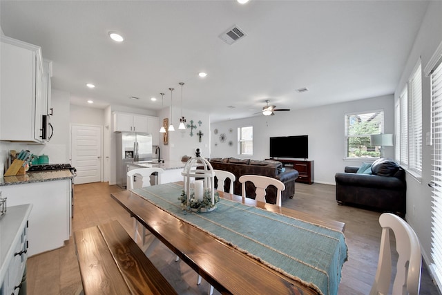 103 Skyshine Ct, Conroe, TX 77304 - dining area with a ceiling fan, light wood-style flooring, plenty of natural light, and recessed lighting