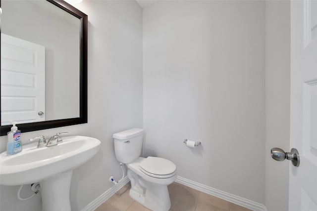 103 Skyshine Ct, Conroe, TX 77304 - half bath with baseboards, toilet, and tile patterned floors