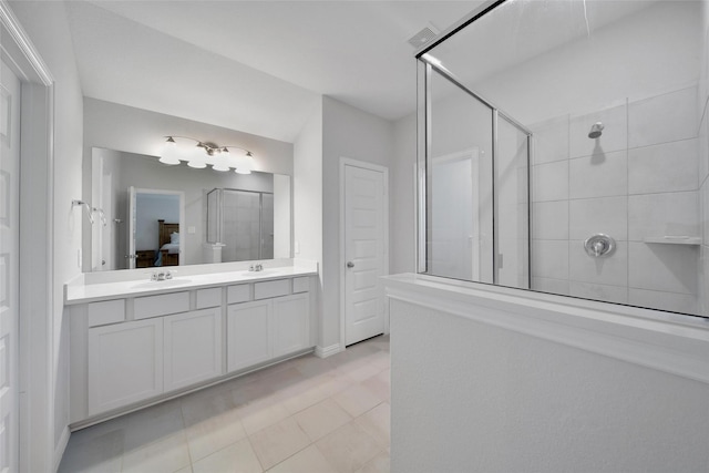 103 Skyshine Ct, Conroe, TX 77304 - full bath featuring a tile shower, double vanity, and tile patterned flooring