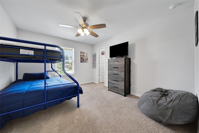 103 Skyshine Ct, Conroe, TX 77304 - bedroom with light colored carpet, baseboards, and ceiling fan