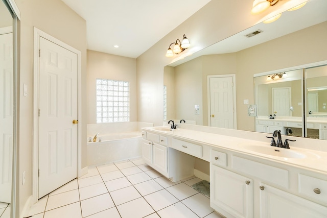 458 Mariners Dr, Kemah, TX 77565 - bathroom with a garden tub, tile patterned flooring, and double vanity