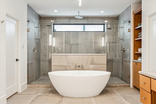 2017 W 14th St Unit A, Houston, TX 77008 - full bath featuring a stall shower, vanity, a soaking tub, and tile patterned floors