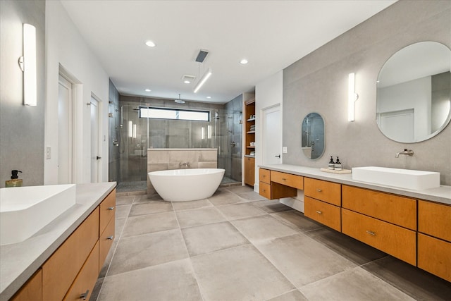 2017 W 14th St Unit A, Houston, TX 77008 - bathroom with a shower stall, two vanities, and recessed lighting
