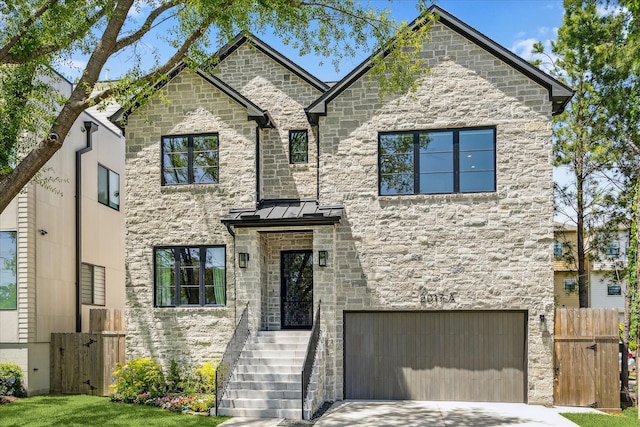 2017 W 14th St Unit A, Houston, TX 77008 - french provincial home featuring a garage, a gate, stone siding, and driveway