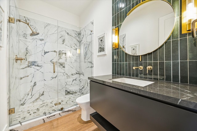 2017 W 14th St Unit A, Houston, TX 77008 - bathroom featuring backsplash, toilet, vanity, and a marble finish shower