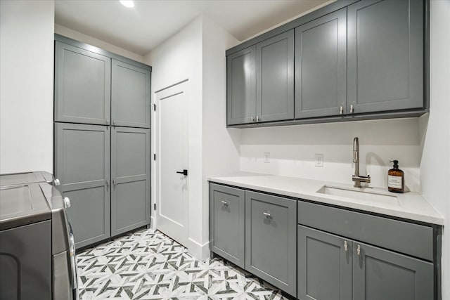 2017 W 14th St Unit A, Houston, TX 77008 - laundry area with cabinet space, washer and dryer, and light flooring