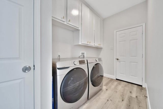 7607 Bankside Dr, Houston, TX 77071 - washroom with independent washer and dryer, light wood finished floors, baseboards, and cabinet space