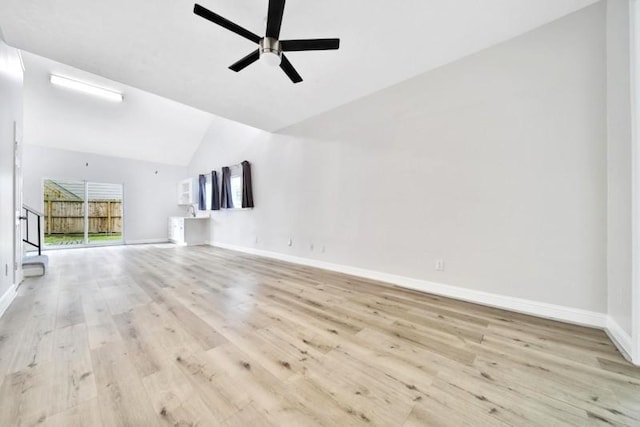 7607 Bankside Dr, Houston, TX 77071 - unfurnished living room with vaulted ceiling, a ceiling fan, wood finished floors, and baseboards