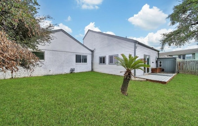 7607 Bankside Dr, Houston, TX 77071 - back of house featuring a deck, a storage shed, brick siding, and an outdoor structure