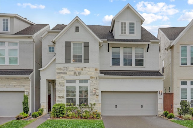 3124 Somerset Levens Ln, Houston, TX 77055 - townhome / multi-family property featuring stone siding, an attached garage, driveway, and a shingled roof