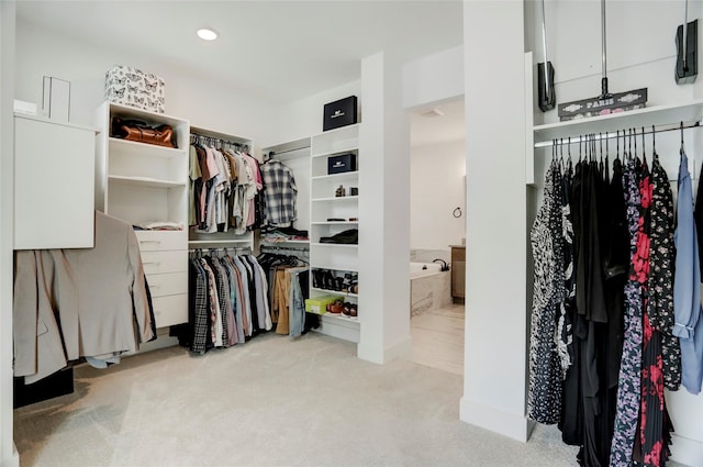 3124 Somerset Levens Ln, Houston, TX 77055 - walk in closet featuring carpet
