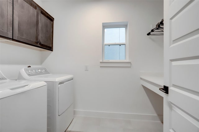 3124 Somerset Levens Ln, Houston, TX 77055 - laundry room featuring cabinet space, washer and dryer, baseboards, and light tile patterned flooring
