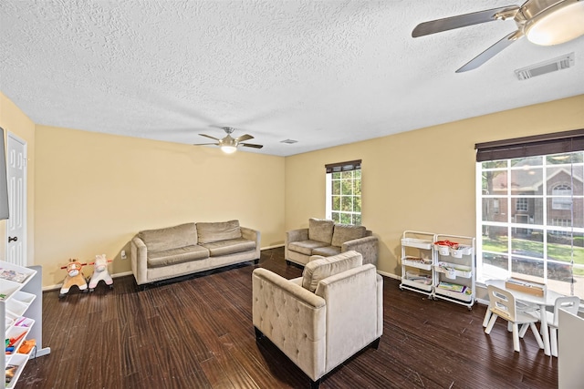 5702 W Vistaglen Loop, Houston, TX 77084 - living room featuring ceiling fan, a textured ceiling, wood finished floors, and baseboards