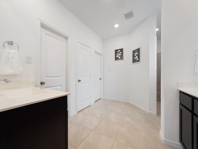 18925 Lazzaro Springs Dr, New Caney, TX 77357 - bathroom with vanity, tile patterned floors, walk in shower, baseboards, and recessed lighting