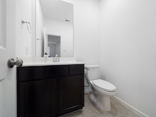 18925 Lazzaro Springs Dr, New Caney, TX 77357 - half bath featuring vanity, baseboards, toilet, and tile patterned floors