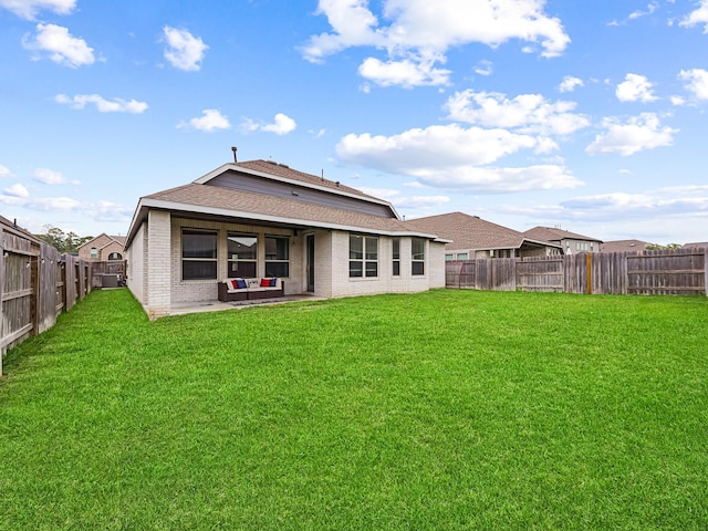 18925 Lazzaro Springs Dr, New Caney, TX 77357 - rear view of property featuring brick siding, a patio area, and roof with shingles