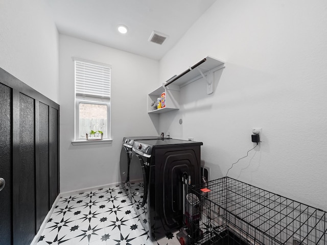 18925 Lazzaro Springs Dr, New Caney, TX 77357 - laundry room with independent washer and dryer, light floors, and baseboards