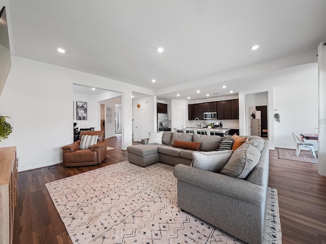 18925 Lazzaro Springs Dr, New Caney, TX 77357 - living area with wood finished floors, recessed lighting, and baseboards