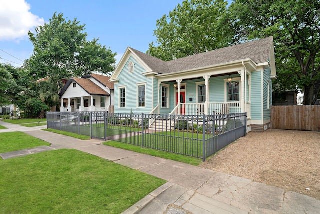 1610 Crockett St, Houston, TX 77007 - view of front of home featuring covered porch and roof with shingles