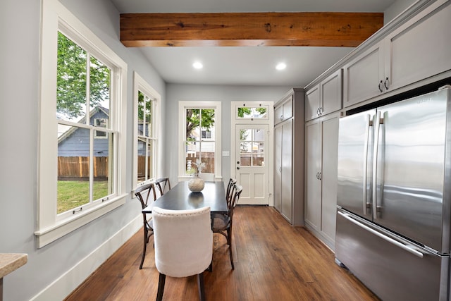 1610 Crockett St, Houston, TX 77007 - dining space featuring plenty of natural light, dark wood finished floors, beamed ceiling, recessed lighting, and baseboards