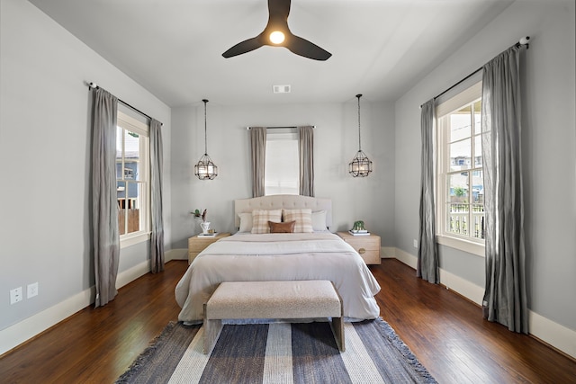 1610 Crockett St, Houston, TX 77007 - bedroom featuring dark wood-style floors, baseboards, and a ceiling fan