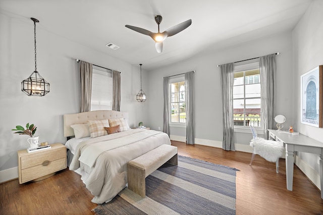 1610 Crockett St, Houston, TX 77007 - bedroom with dark wood-type flooring, baseboards, and a ceiling fan