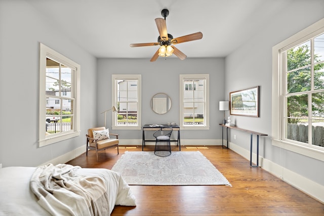 1610 Crockett St, Houston, TX 77007 - sitting room with wood finished floors, baseboards, and ceiling fan