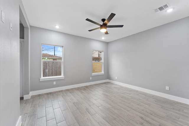 7926 Tate St, Houston, TX 77028 - empty room featuring plenty of natural light, ceiling fan, light wood-style flooring, baseboards, and recessed lighting