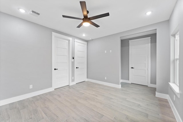 7926 Tate St, Houston, TX 77028 - unfurnished bedroom with light wood-style floors, recessed lighting, baseboards, and a ceiling fan