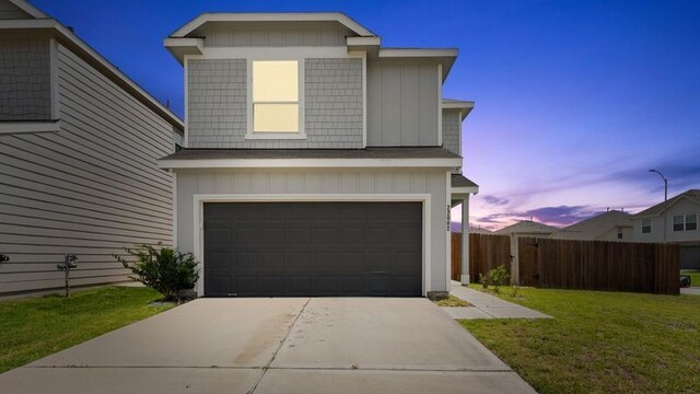 22002 Sovereign Heights Ln, Houston, TX 77073 - view of front of home with an attached garage, board and batten siding, and concrete driveway