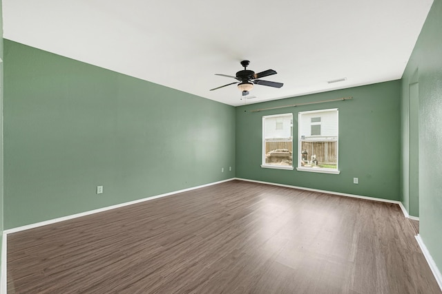 4814 Winding Timbers Ct, Humble, TX 77346 - unfurnished room with wood finished floors, ceiling fan, and baseboards