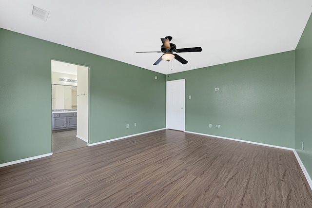 4814 Winding Timbers Ct, Humble, TX 77346 - spare room featuring ceiling fan, wood finished floors, and baseboards