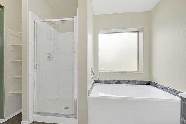 4814 Winding Timbers Ct, Humble, TX 77346 - bathroom with a stall shower and a garden tub