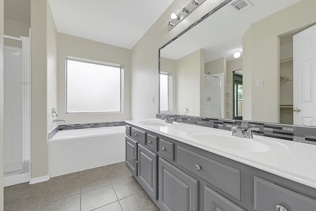 4814 Winding Timbers Ct, Humble, TX 77346 - bathroom with a stall shower, plenty of natural light, tile patterned floors, and double vanity