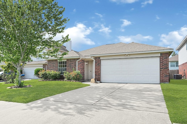 4814 Winding Timbers Ct, Humble, TX 77346 - view of front of property featuring brick siding, a garage, concrete driveway, and a front yard