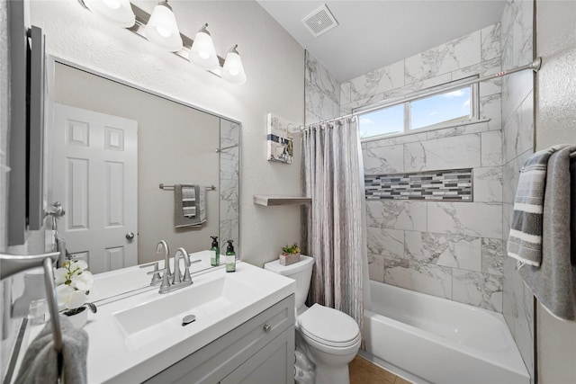 8630 Kirksage Dr, Houston, TX 77089 - full bath with toilet, shower / bath combination with curtain, vanity, and a textured wall