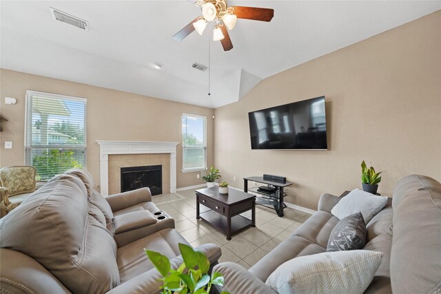 8630 Kirksage Dr, Houston, TX 77089 - living area featuring light tile patterned floors, a ceiling fan, baseboards, vaulted ceiling, and a tiled fireplace