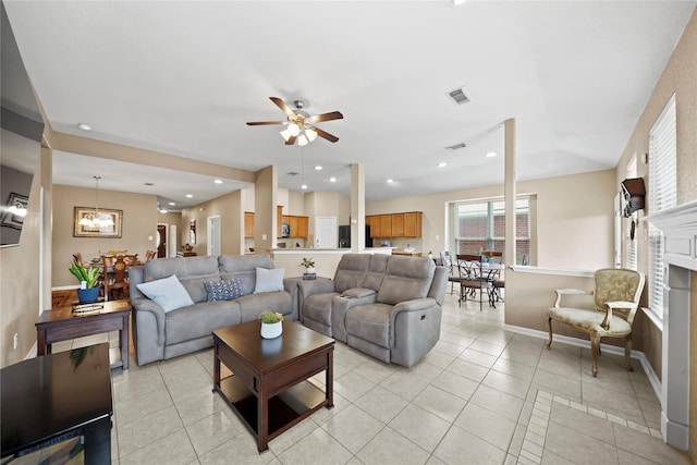 8630 Kirksage Dr, Houston, TX 77089 - living area featuring a ceiling fan, light tile patterned floors, baseboards, recessed lighting, and a fireplace