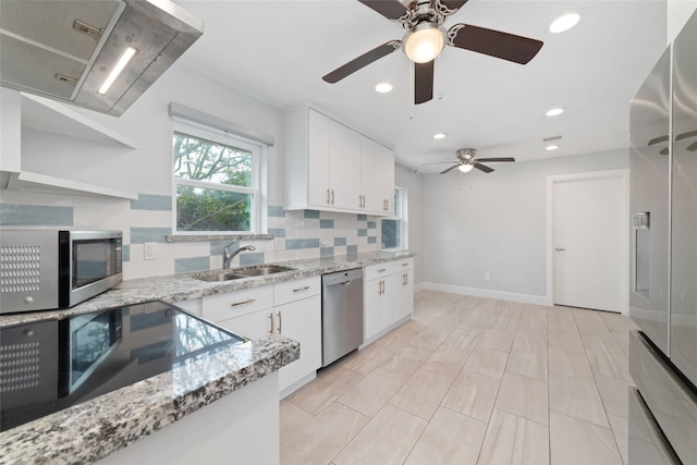 5006 Lymbar Dr, Houston, TX 77096 - kitchen featuring a sink, stainless steel appliances, exhaust hood, backsplash, and a ceiling fan