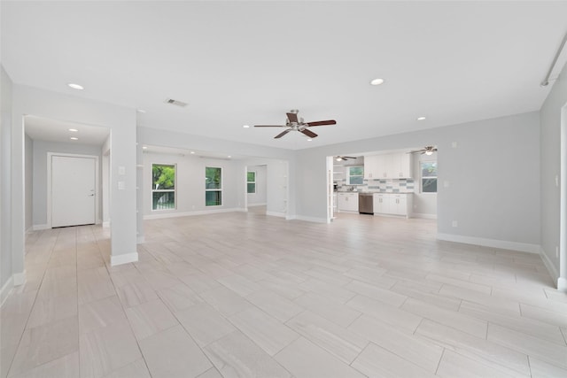 5006 Lymbar Dr, Houston, TX 77096 - unfurnished living room featuring a ceiling fan, recessed lighting, and baseboards