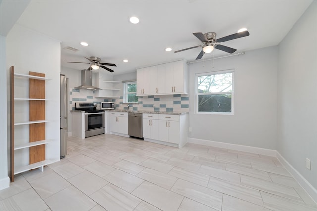 5006 Lymbar Dr, Houston, TX 77096 - kitchen with stainless steel appliances, wall chimney exhaust hood, open shelves, ceiling fan, and healthy amount of natural light