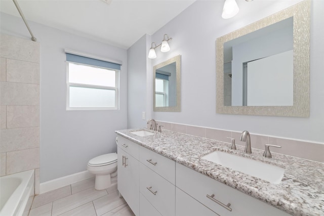 5006 Lymbar Dr, Houston, TX 77096 - full bathroom featuring toilet, double vanity, washtub / shower combination, and baseboards