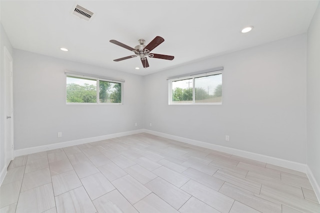 5006 Lymbar Dr, Houston, TX 77096 - empty room featuring healthy amount of natural light, a ceiling fan, recessed lighting, and baseboards