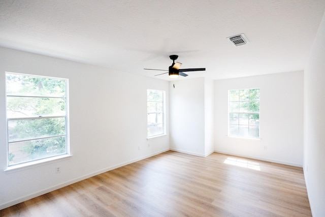 25014 Rettendon Ct, Spring, TX 77389 - unfurnished room with light wood-style flooring, baseboards, and a ceiling fan