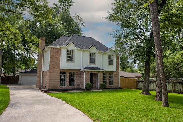 25014 Rettendon Ct, Spring, TX 77389 - view of front facade featuring a chimney, an outdoor structure, brick siding, stucco siding, and a detached garage